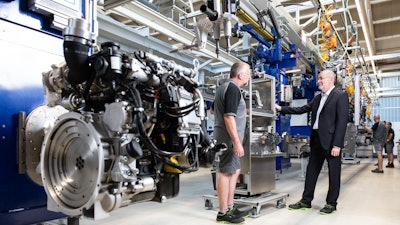 Wilfried Riemann, COO (right), and Martin Kandlinger, Equipment design/automation technology, during the renovations of the state-of-the-art engine production line, where the Hatz H-series engines are constructed.