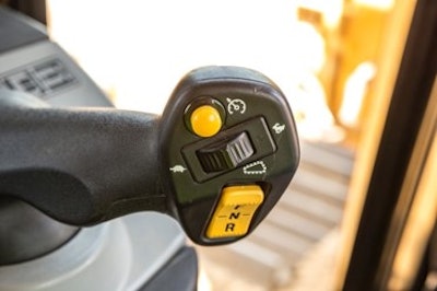 A new detented thumb roller aids gear and speed selection by enabling operators to shift the tractor in either 0.1 or 0.5 speed increments.