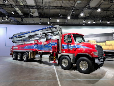 The Freightliner 114SD with a concrete pumper body.