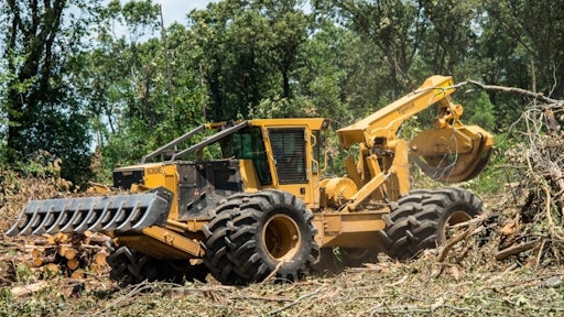 Tigercat 630E Grapple Skidder with Primex Log Stomper Xtreme Flotation Tires size 35.5-32 on the inside and a 24.5-32 on the outside.