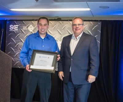 SAE/AEM Outstanding Young Engineer award winner Stephen Lanahan (left) pictured with SAE Board of Directors Commercial Vehicle Vice President Landon Sproull of PACCAR Inc. at 2018 ceremonies.