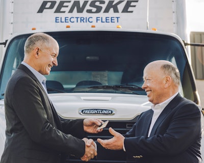 Daimler Trucks North America CEO Roger Nielsen delivers the first Freightliner eM2 electric commercial vehicle to Penske Truck Leasing CEO Brian Hard.