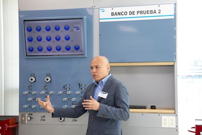 Juan Carlos Mellado, Director of Product Engineering at Bendix – Mexico, introduces attendees to a lab during the grand opening of Bendix’s new Technical Center in Monterrey, Mexico.