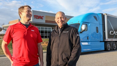 Michael Fleming, CEO of Torc Robotics, (left) and Roger Nielsen, CEO of Daimler Trucks North America LLC, in front of the Torc headquarters in Blacksburg, VA.