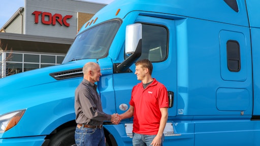 Roger Nielsen, CEO of Daimler Trucks North America LLC, (left) and Michael Fleming, CEO of Torc Robotics, celebrate the new partnership between their two companies.