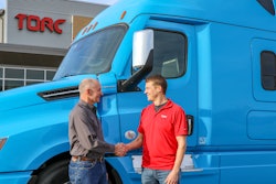 Roger Nielsen, CEO of Daimler Trucks North America LLC, (left) and Michael Fleming, CEO of Torc Robotics, celebrate the new partnership between their two companies.