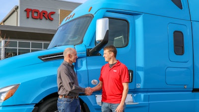 Roger Nielsen, CEO of Daimler Trucks North America LLC, (left) and Michael Fleming, CEO of Torc Robotics, celebrate the new partnership between their two companies.