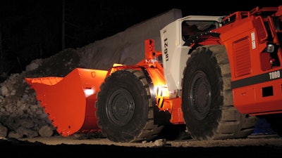A Sandvik loader operating underground.