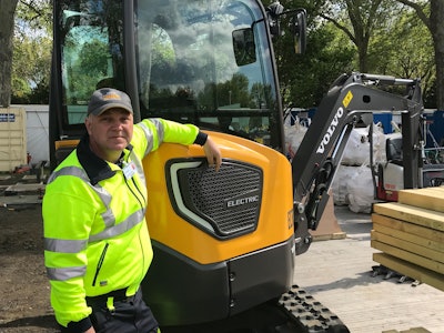 Operator Peter Holmberg with the ECR25 Electric on site in The Morgan Stanley Garden at RHS Chelsea Flower Show.