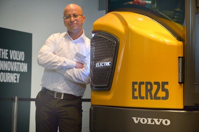 Ahcène Nedjimi, Electromobility Specialist at Volvo CE, with the ECR25 Electric.