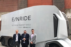 Michelin and Einride executives in front of the autonomous electric truck at the Movin'On Summit.