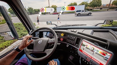 A demonstration of Perceptive Automata's artificial intelligence tracking and signaling in real-time the likely intention to cross and awareness of two pedestrians near a Volvo VNR 300 heavy-duty truck model. The AI is able to track, in parallel and with a 360-degree field of view, a practically unlimited number of pedestrians, cyclists, and vehicles to enhance professional drivers' situational awareness in road environments.