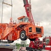 Loading the KAMAG slab transporter onto the ship at Heilbronn harbor.