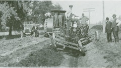 The leaning wheel principle on full display, with two 12-ft. graders forming a ditch in McLean County, IL. The first grader slopes the outside bank and places spoil in the ditch, and the second draws it out to the roadbed while trimming the inside bank.