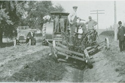 The leaning wheel principle on full display, with two 12-ft. graders forming a ditch in McLean County, IL. The first grader slopes the outside bank and places spoil in the ditch, and the second draws it out to the roadbed while trimming the inside bank.