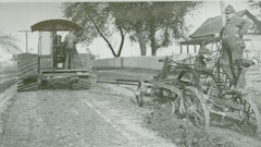 Offset grading near Clinton, IL, with an Adams Road King and a Rumley Oil Pull tractor.