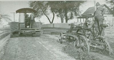 Offset grading near Clinton, IL, with an Adams Road King and a Rumley Oil Pull tractor.