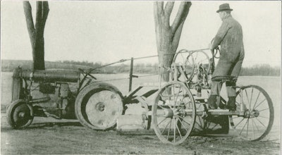 Introduced in 1924, the Edwards Fordson One-Man Maintainer is the earliest dated example of a grader operator being able to control the towing tractor from a grader; but Stockland Manufacturing Company claimed to have invented the idea.