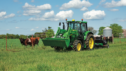The John Deere 6120M Tractor, matched with the 600R Loader, has the horsepower and versatility to handle a wide variety of chores around the farm.
