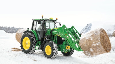 The redesigned John Deere 6110M has a shorter wheel base for greater maneuverability and sloped hood for improved visibility. It can be ordered with front hitch and PTO.