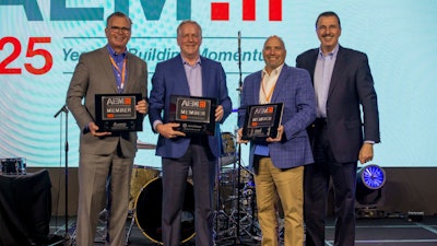 AEM’s three 125-year member companies received recognition at the association’s recent annual conference. Company representatives pictured are (L-R): Robert Crain (AGCO), John Lagemann (Deere) and Scott Harris (CNH), with AEM President Dennis Slater.