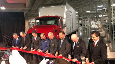 Mack executives and Virginia officials cut the ribbon to officially open the new production facility.