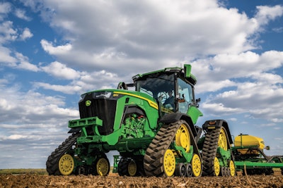 The John Deere 8RX is a fixed frame, four track tractor.