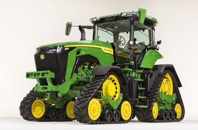 The four-track option on the John Deere 8R tractor offers improved maneuverability through wet fields and helps to reduce soil compaction.