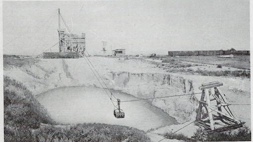 A 1-yd. Slackline Dragline bucket brings in a load of wet gravel.