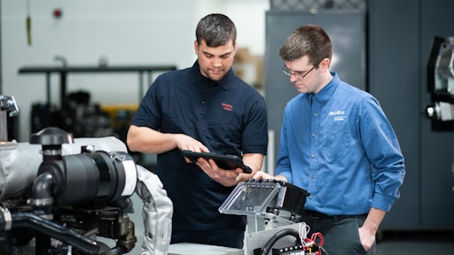 Technical activity occurring at the Isuzu Wixom Prototype Center.