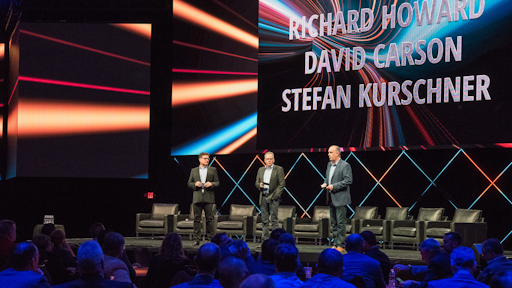 David Carson, Richard Howard and Stefan Kurschner address Freightliner and Western Star dealers at DTNA's annual dealer meeting.