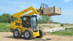 The SW32 100 hp skid steer vertical lift arm offers a hinge-pin height of 134.8 in., which is ideal for using pallet forks and loading high-sided trucks.