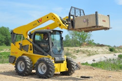 The SW32 100 hp skid steer vertical lift arm offers a hinge-pin height of 134.8 in., which is ideal for using pallet forks and loading high-sided trucks.