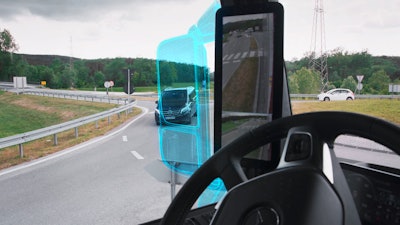The marked area illustrates the visual gain achieved by replacing traditional rearview mirrors with a camera replacement system.