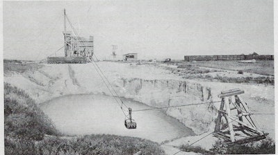 A 1-yd. Slackline Dragline bucket brings in a load of wet gravel.