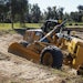 The Mastless motor grader configuration gives operators improved range of blade motion.