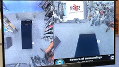 The system combines images from four cameras around the vehicle to provide a single 360-degree view.