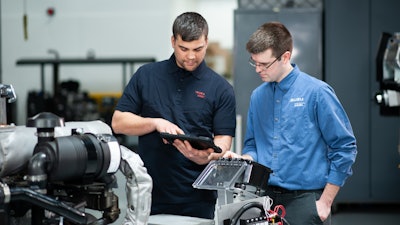 Technical activity occurring at the Isuzu Wixom Prototype Center.