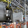 Use of Comau’s MATE exoskeleton are helping relieve fatigue for workers at an IVECO production facility.
