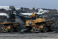 Two Cat 797 F Autonomous Trucks Being Loaded In Pit