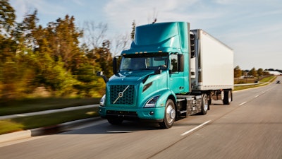 Volvo Vnr Electric 4x2 With Reefer Trailer Driver Side View On The Road