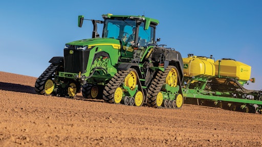 John Deere 8RX 410 Tractor fitted with ExactRate Tractor Tanks pulling a 1775 NT Planter.