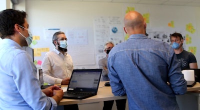 An innovation team meeting at Poclain Hydraulics. Collaboration like this can help to improve the process for developing new products and innovations in the hydraulics industry.