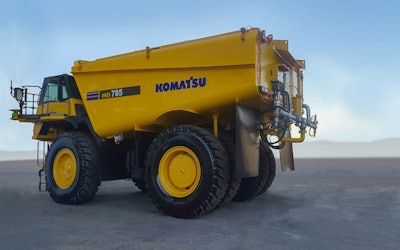 A Komatsu HD785 water truck is pictured. The company is working to make an autonomous version of the truck available to customers in 2022.
