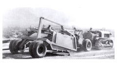 The first scraper to be equipped with pneumatic tires is pulled by an Allis-Chalmers crawler tractor in California’s Imperial Valley in August 1932.