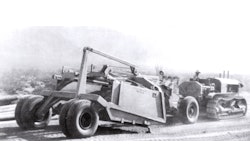 The first scraper to be equipped with pneumatic tires is pulled by an Allis-Chalmers crawler tractor in California’s Imperial Valley in August 1932.