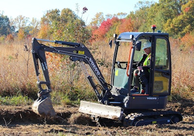 The ECR25 Electric compact excavator is digging trenches to improve drainage from a pond at the Occoquan Bay National Wildlife Refuge.