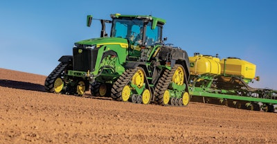 John Deere 8RX 410 Tractor fitted with ExactRate Tractor Tanks pulling a 1775 NT Planter.