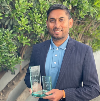 Aravind Kailas of VGNA accepts the SCAQMD Award for its work in the Volvo LIGHTS project.