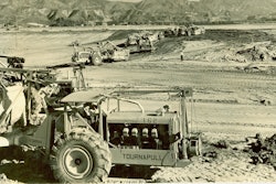 The first scraper to be equipped with pneumatic tires is pulled by an Allis-Chalmers crawler tractor in California’s Imperial Valley in August 1932.